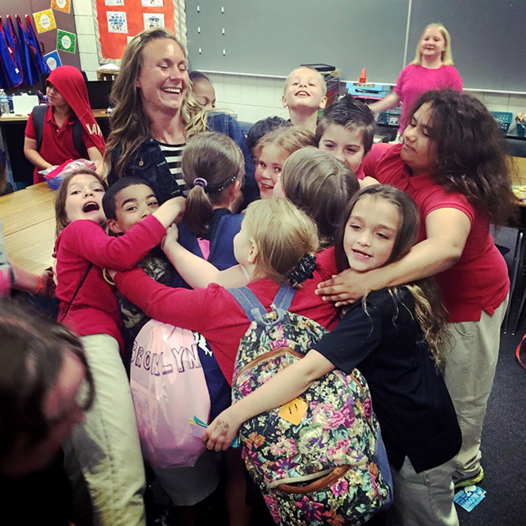 Valerie Stearns gets an end-of-the-year hug from her third-grade class at Fostoria Elementary School in Fostoria, Ohio. Stearns, a first lieutenant in the Ohio Army National Guard, has found ways to develop her competitive spirit in developing young minds and in uniform.
