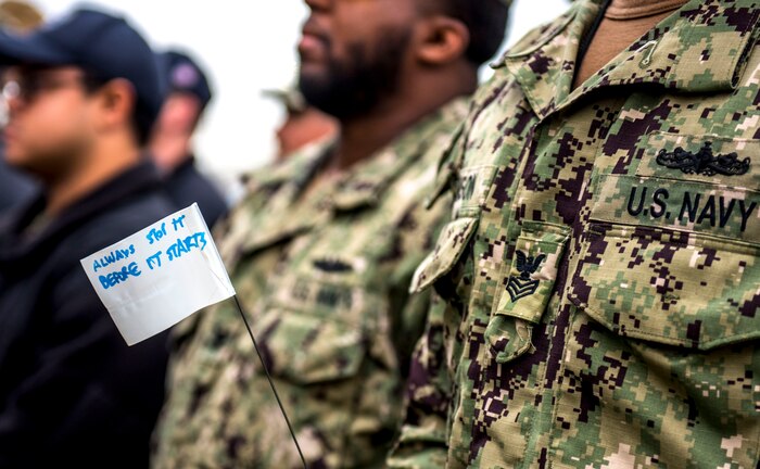 190405-N-ET513-0064 PORTSMOUTH, Va. (April 5, 2019) Sailors assigned to the aircraft carrier USS George H.W. Bush (CVN 77) hold flags with encouraging messages during a kickoff event for Sexual Assault Awareness and Prevention Month. The event was a combined effort with GWHB Sailors and Sailors from Norfolk Naval Shipyard. GHWB is at Norfolk Naval Shipyard (NNSY) undergoing a Docking Planned Incremental Availability (DPIA). (U.S. Navy Photo by Mass Communication Specialist 3rd Class Kallysta Castillo)