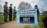 190405-N-ET513-0075 PORTSMOUTH, Va. (April 5, 2019) Sailors assigned to the aircraft carrier USS George H.W. Bush (CVN 77) hold flags with encouraging messages during a kickoff event for Sexual Assault Awareness and Prevention Month. The event was a combined effort with GWHB Sailors and Sailors from Norfolk Naval Shipyard. GHWB is at Norfolk Naval Shipyard (NNSY) undergoing a Docking Planned Incremental Availability (DPIA). (U.S. Navy Photo by Mass Communication Specialist 3rd Class Kallysta Castillo)