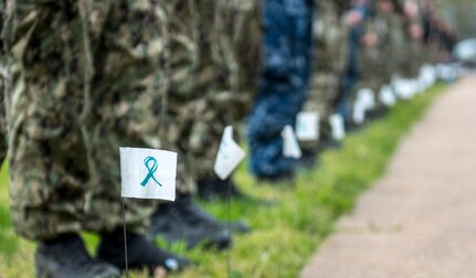 190405-N-ET513-0094 PORTSMOUTH, Va. (April 5, 2019) Sailors assigned to the aircraft carrier USS George H.W. Bush (CVN 77) stand next to flags with encouraging messages during a kickoff event for Sexual Assault Awareness and Prevention Month. The event was a combined effort with GWHB Sailors and Sailors from Norfolk Naval Shipyard. GHWB is at Norfolk Naval Shipyard (NNSY) undergoing a Docking Planned Incremental Availability (DPIA). (U.S. Navy Photo by Mass Communication Specialist 3rd Class Kallysta Castillo)