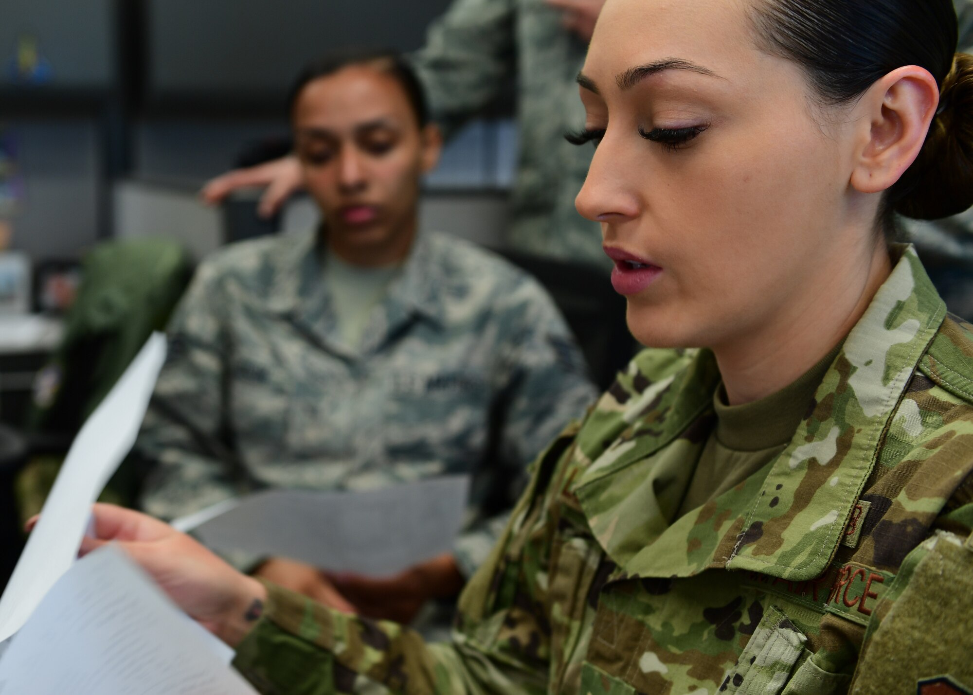 Staff Sgt. Karina Lopez, Aeromedical Evacuation duty controller with the 18th AE Detachment 1, based out of Joint Base Pearl Harbor-Hickam, Hawaii but attached to Kadena Air Base, Japan, goes through intake procedures with members of the 911th Aeromedical Evacuation Squadron at Joint Base Pearl Harbor-Hickam, Hawaii April 25, 2019. The training the 911th Airlift Wing Airmen received was meant to prepare new Airmen for deployment procedures. (U.S. Air Force Photo by Senior Airman Grace Thomson)
