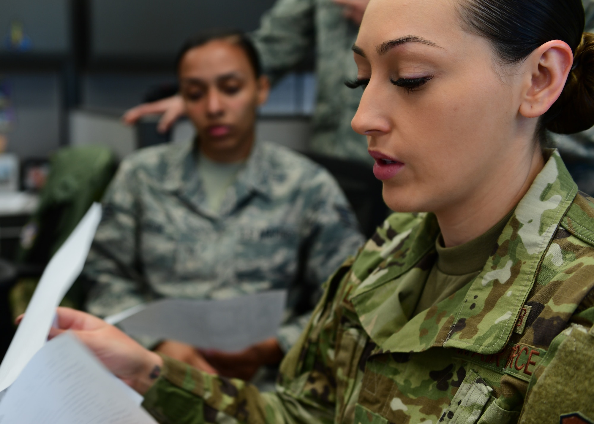 Staff Sgt. Karina Lopez, Aeromedical Evacuation duty controller with the 18th AE Detachment 1, based out of Joint Base Pearl Harbor-Hickam, Hawaii but attached to Kadena Air Base, Japan, goes through intake procedures with members of the 911th Aeromedical Evacuation Squadron at Joint Base Pearl Harbor-Hickam, Hawaii April 25, 2019. The training the 911th Airlift Wing Airmen received was meant to prepare new Airmen for deployment procedures. (U.S. Air Force Photo by Senior Airman Grace Thomson)