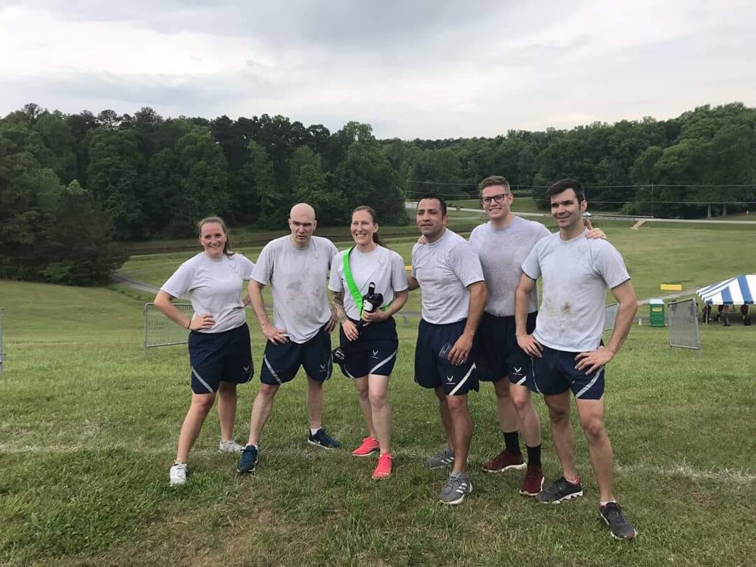 Reservists from the 67th Aerial Port Squadron gather for a group photo after completing the “Fit to Fight” portion of the Port Dawg Challenge