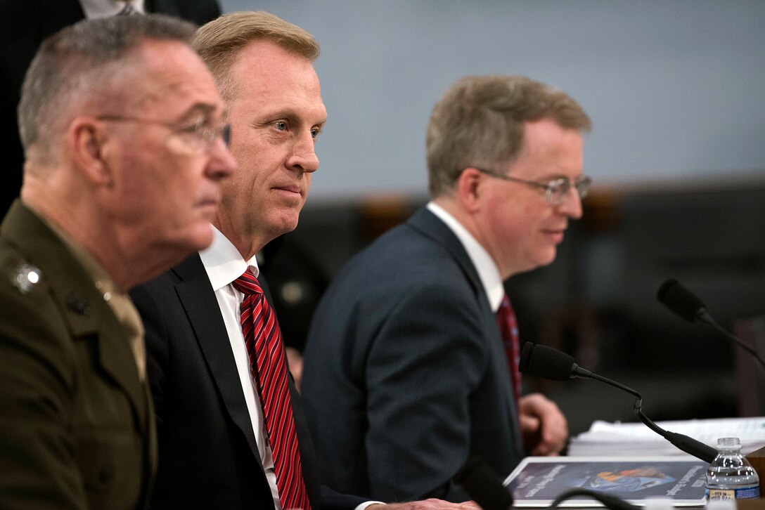 Marine Corps Gen. Joe Dunford Jr., Acting Defense Secretary Patrick M. Shanahan and David L. Norquist sit at a table.