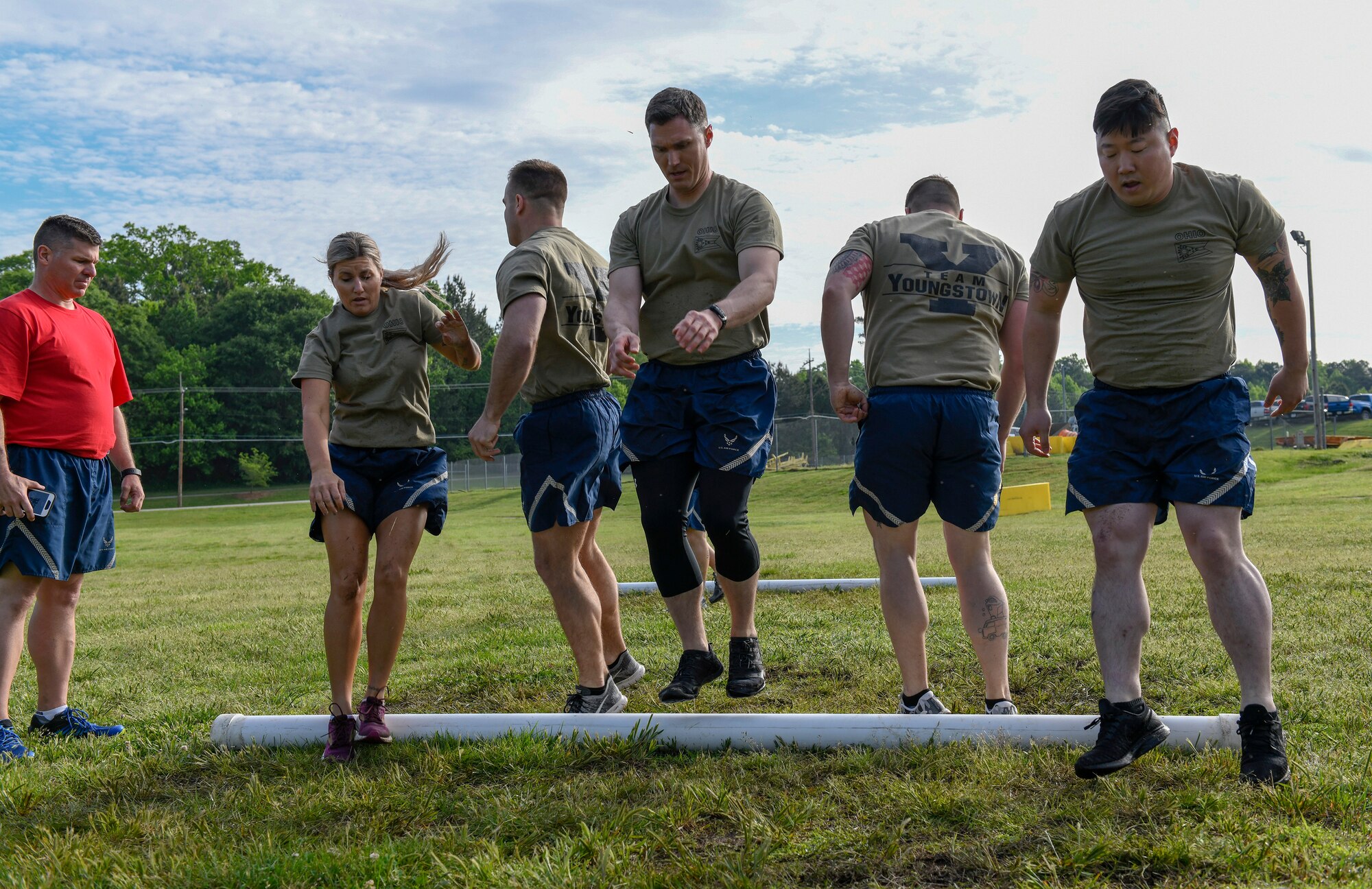 Reserve Citizen Airmen assigned to the 76th Aerial Port Squadron jump over a pipe during the fitness competition at the Port Dawg Challenge April 24, 2019, at Dobbins Air Reserve Base, Georgia.
