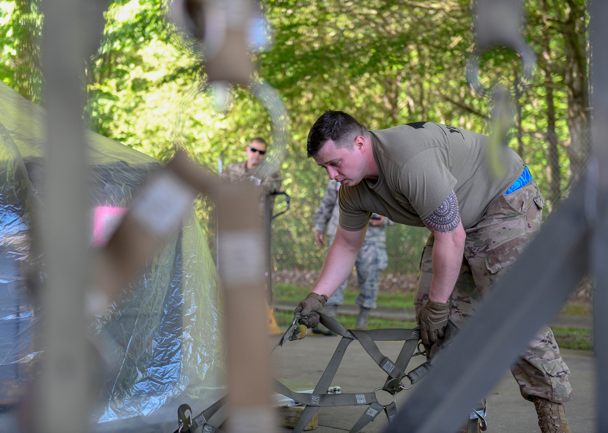 Master Sgt. Zach Dunkin, NCO in charge of load planning assigned to the 76th Aerial Port Squadron, palletizes cargo during the pallet build-up competition at the Port Dawg Challenge April 24, 2019, at Dobbins Air Reserve Base, Georgia.