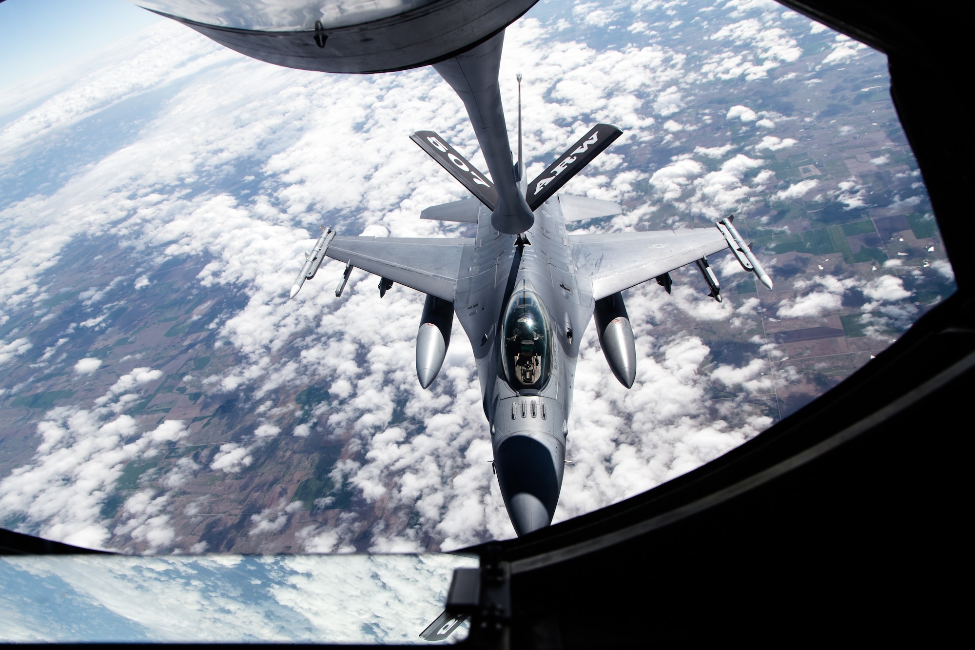 A 138th Fighter Wing F-16 Fighting Falcon from Tulsa Air National Guard Base, Oklahoma, refuels from a KC-135R Stratotanker April 25, 2019. The Stratotanker, from the 507th Air Refueling Wing at Tinker Air Force Base, Oklahoma, refueled four 138th Fighter Wing F-16 Fighting Falcons during flight operations over Kansas. (Courtesy photo by Mike Killian)