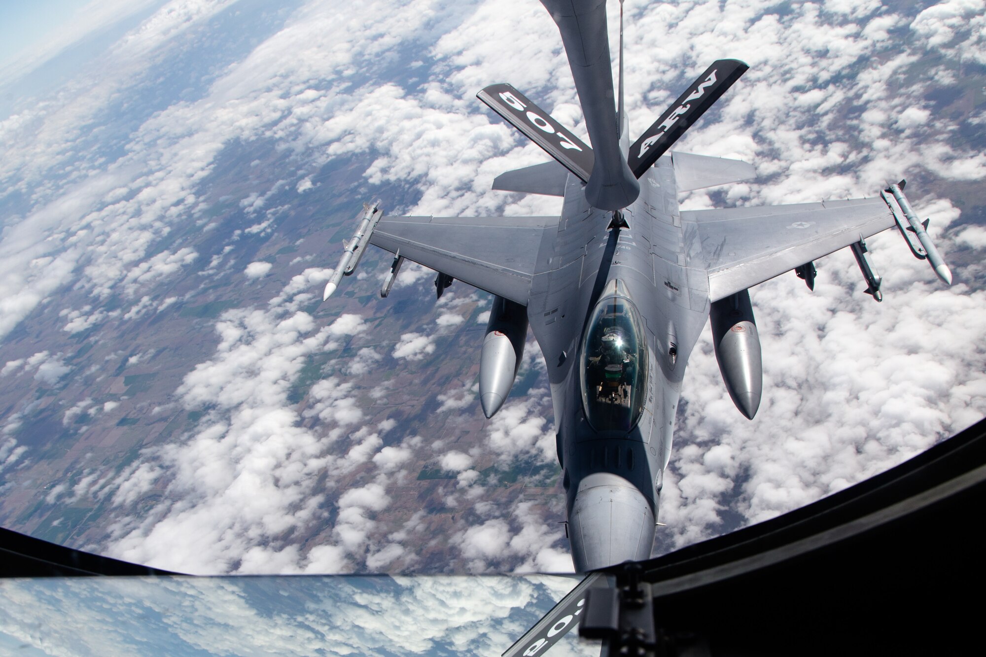 A 138th Fighter Wing F-16 Fighting Falcon from Tulsa Air National Guard Base, Oklahoma, refuels from a KC-135R Stratotanker April 25, 2019. The Stratotanker, from the 507th Air Refueling Wing at Tinker Air Force Base, Oklahoma, refueled four 138th Fighter Wing F-16 Fighting Falcons during flight operations over Kansas. (Courtesy photo by Mike Killian)