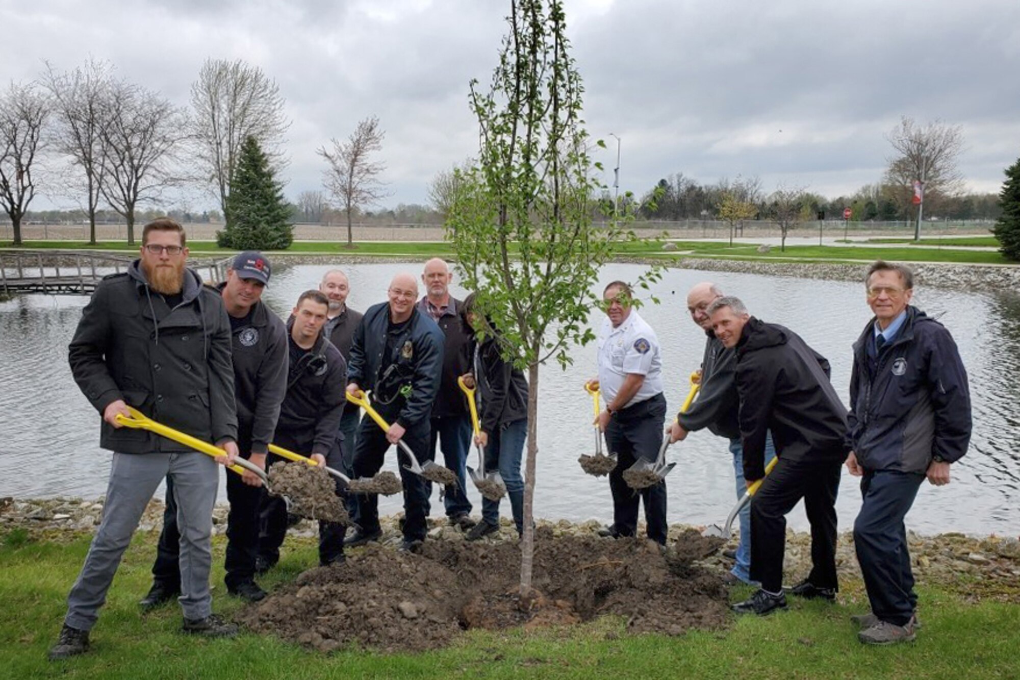 Grissom personnel pose for a photo during a special Arbor Day ceremony held here April 26, 2019. Each year Arbor Day is celebrated on the last Friday of April. Its celebration provides an opportunity to learn about trees and take positive action to make the world a better place. (U.S. Air Force photo/Master Sgt. Ben Mota)
