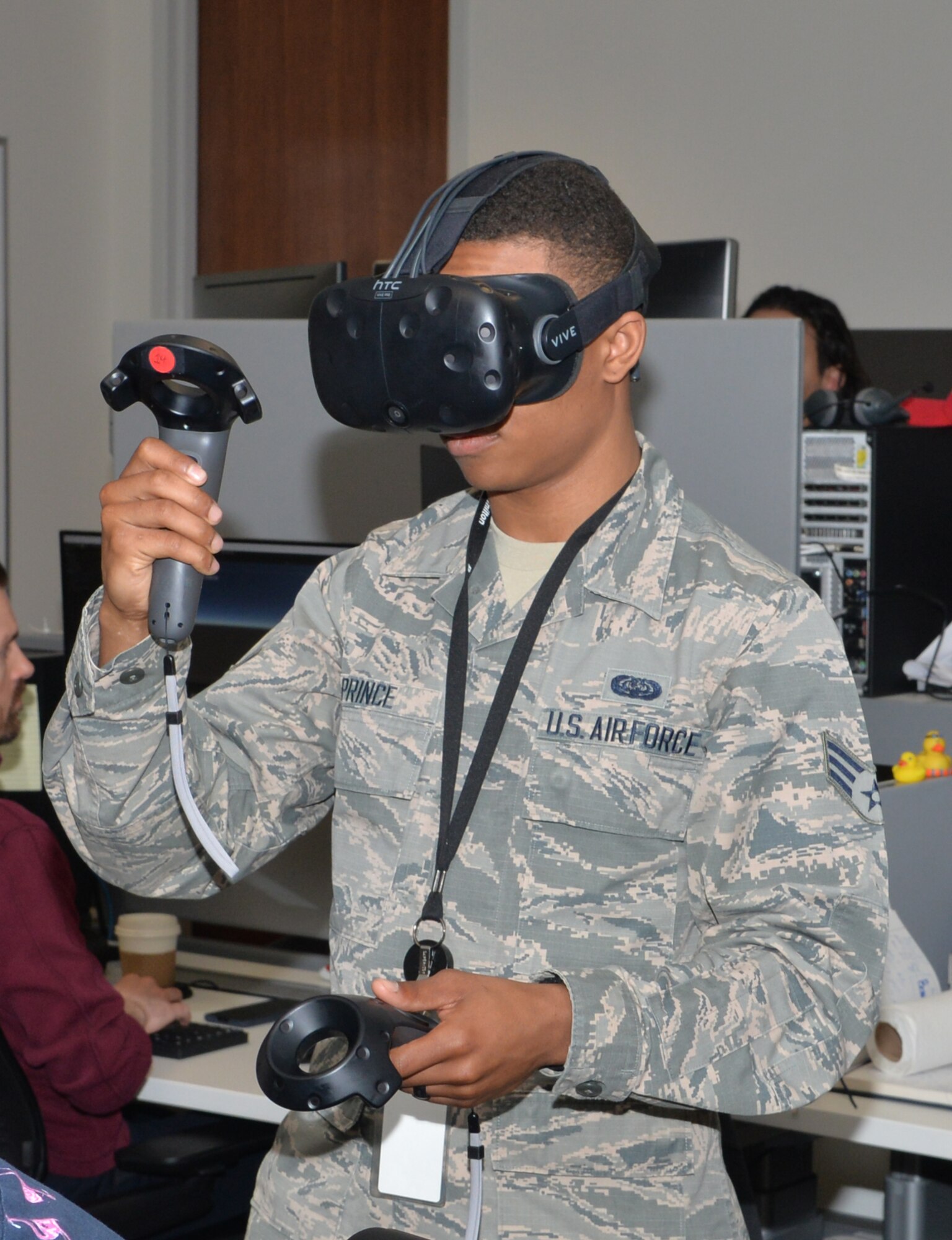 Senior Airman Jordan Prince, 55th Communications Squadron cable maintenance, tests virtual reality equipment that interacts with initial safety check procedures at Booz Allen Hamilton April 19, 2019, in Omaha, Nebraska. Incorporating safety into virtual procedures is one of the program priorities.  (U.S. Air Force photo by D.P. Heard)