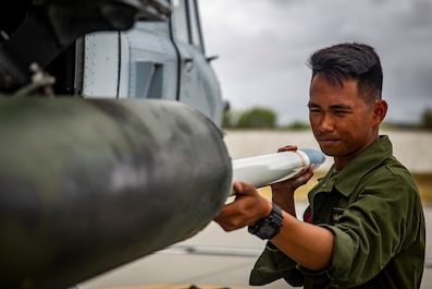 HMLAT-303 Marines conduct ordnance loading