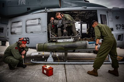 HMLAT-303 Marines conduct ordnance loading