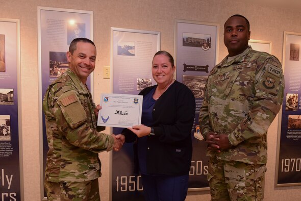 Pepper Barrera, 47th Medical Group utilization and case manager, was chosen by wing leadership to be the “XLer” of the week, for the week of April 22, 2019, at Laughlin Air Force Base, Texas. The “XLer” award, presented by Col. Lee Gentile, 47th Flying Training Wing commander, is given to those who consistently make outstanding contributions to their unit and the Laughlin mission. (U.S. Air Force photo by Airman 1st Class Anne McCready)