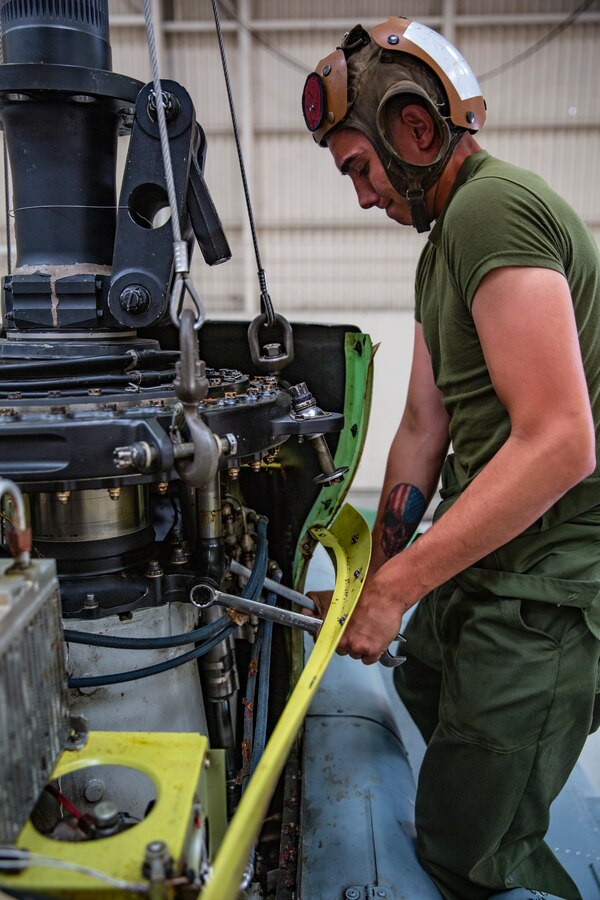 U.S. Marine Corps Cpl. Brandon Thompson, a UH/AH-1 helicopter mechanic with Marine Light Attack Helicopter Squadron 469, Marine Aircraft Group 39, 3rd Marine Aircraft Wing, loosens a bolt on the swash blade of a UH-1Y Venom helicopter during routine maintenance at Marine Corps Air Station (MCAS) Camp Pendleton, California, April 29, 2019. Routine aircraft maintenance is performed around-the-clock to ensure that the aircraft housed at MCAS Camp Pendleton are ready to perform daily flight operations. (U.S. Marine Corps photo by Cpl. Dylan Chagnon)