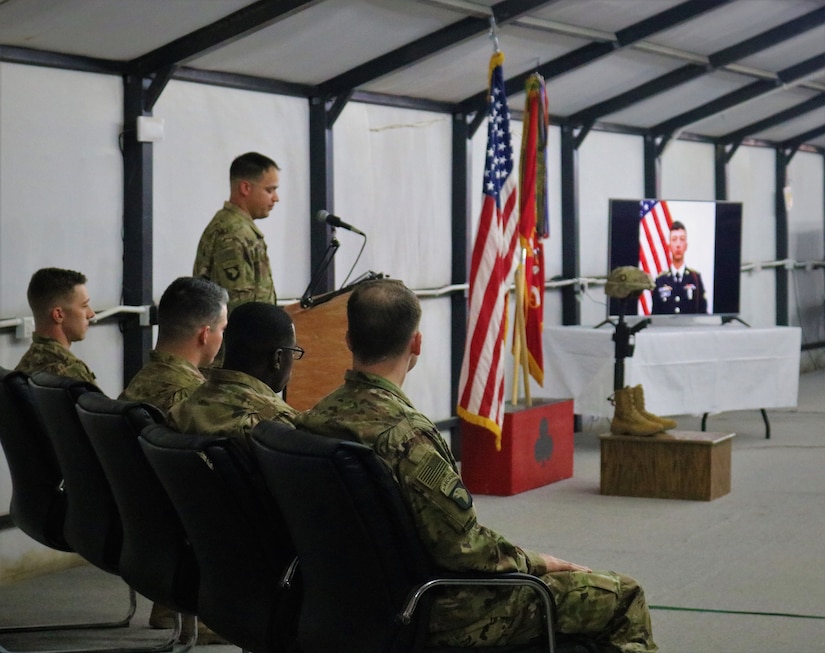 Capt. John Fridlington, 101st Airborne Division, speaks during a memorial service for Spc. Ryan Riley at Qayyarah West Airfield, Iraq, March 25, 2019.