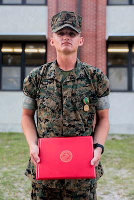 Lance Cpl. Caleb Eudy, with Charlie Company, 1st Recruit Training Battalion, is awarded a Navy and Marine Corps Achievement Medal on Parris Island, S.C. April 26, 2019.