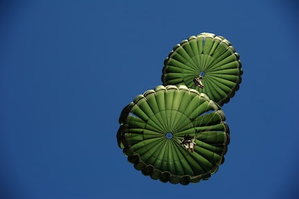 U.S. Army soldiers from Utah Army National Guard, descend during a static line jump, Fairfield, Utah, Nov. 9, 2011