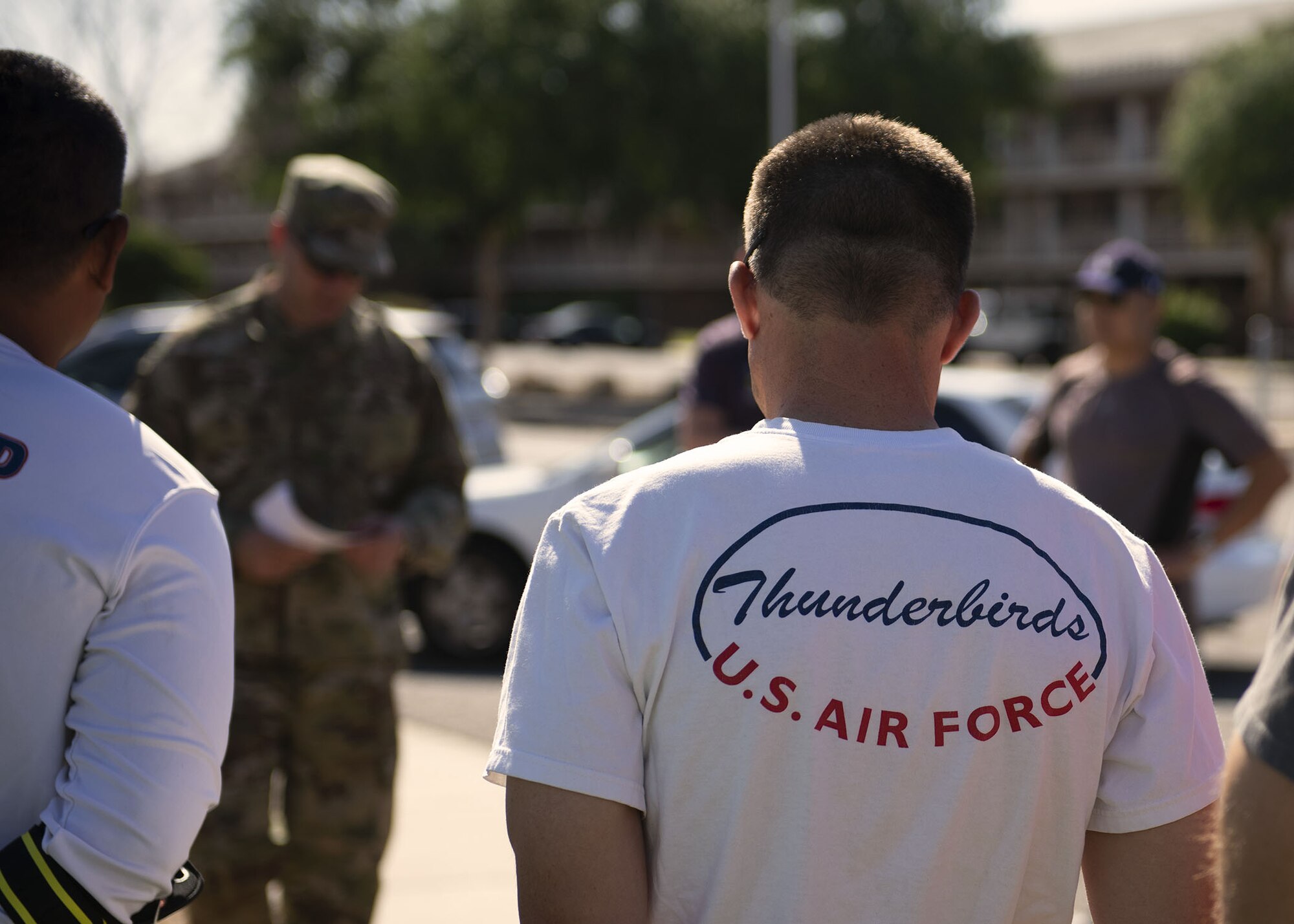 Airmen listen to a speech about pilot, Maj. Stephen “Cajun” Del Bagno, at the Cajun Remembrance Run April 30, 2019, at Luke Air Force Base, Ariz.
