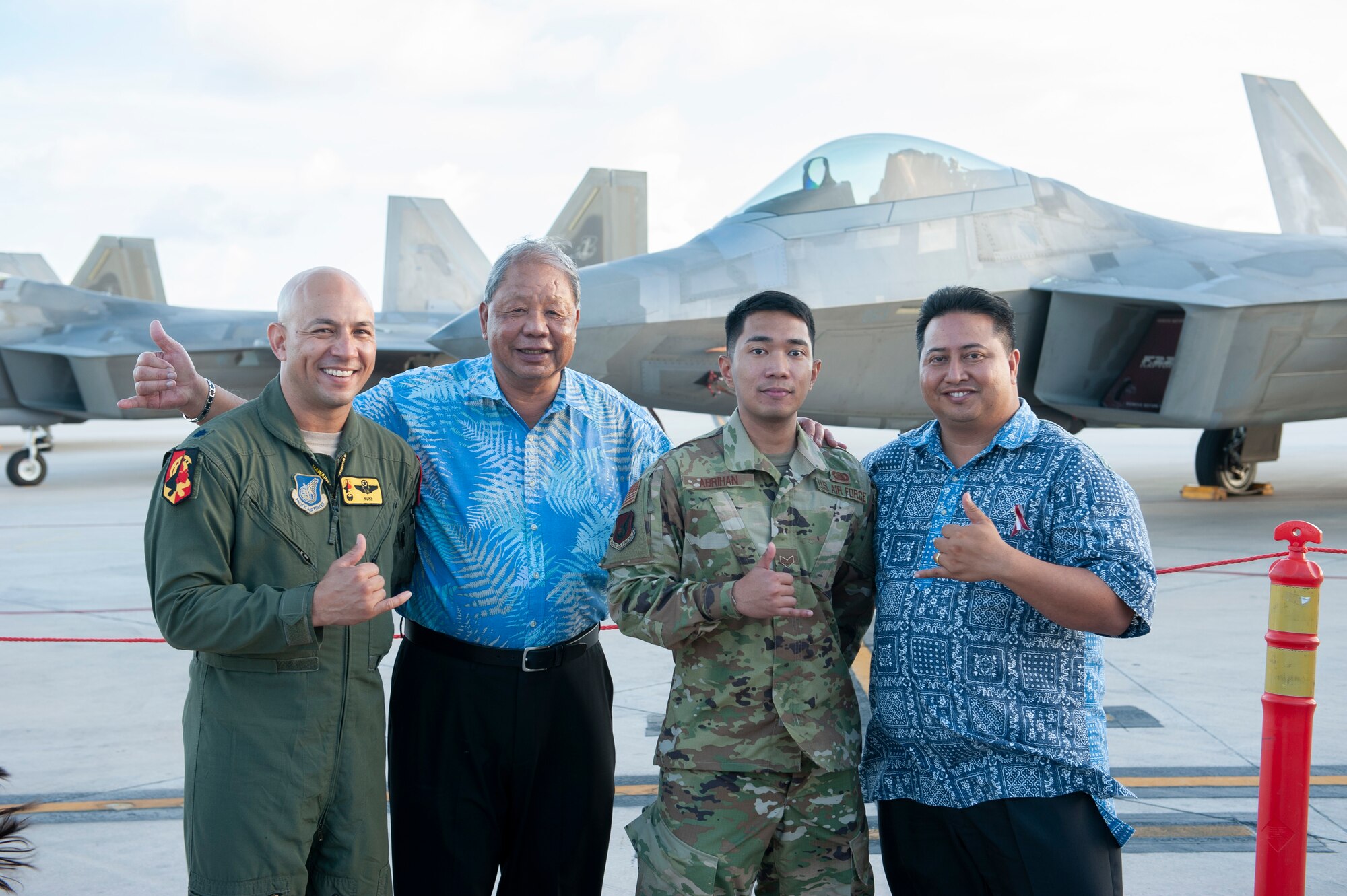 Lt. Col. Shane Nagatani, 199th Fighter Squadron commander, David M. Apatang, Saipan Mayor, Senior Airman Mark Abriham, 36th Communications Squadron radio technician, and Ralph Torres, Governor of Saipan, gather during an F-22 static display tour April 23, 2019, at the Francisco C. Ada International Airport, Saipan. Abriham, a Saipan native, returned home on military orders and supported the ‘Hawaiian Raptors’ during their inaugural visit to his home island. The movement of F-22 Raptor aircraft was part of the Pacific Air Forces exercise Resilient Typhoon, designed to prepare aircraft and personnel to disperse in the face of inclement weather. (U.S. Air National Guard photo by Senior Airman John Linzmeier)