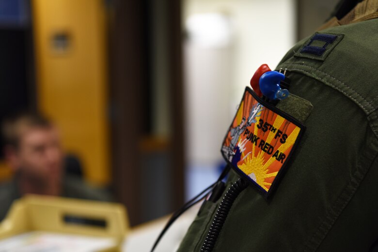 A U.S. Air Force pilot from the 35th Fighter Squadron receives a preflight brief at Kunsan Air Base, Republic of Korea, April 24, 2019. The 35th FS conducts flying operations on a routine basis to hone their skills in any conditions. (U.S. Air Force photo by Staff Sgt. Joshua Edwards)