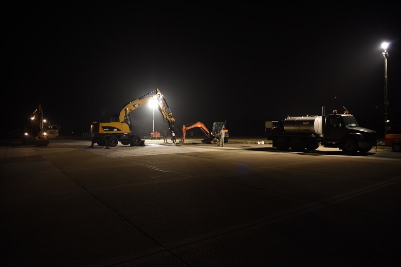 U.S. Air Force 8th Civil Engineer Squadron members work to repair a rupture at Kunsan Air Base, Republic of Korea, May 1, 2019. 8th CES and 8th Logistics Readiness Squadron members responded to incident and made the flight line operational again within 24 hours. (U.S. Air Force photo by Staff Sgt. Joshua Edwards)