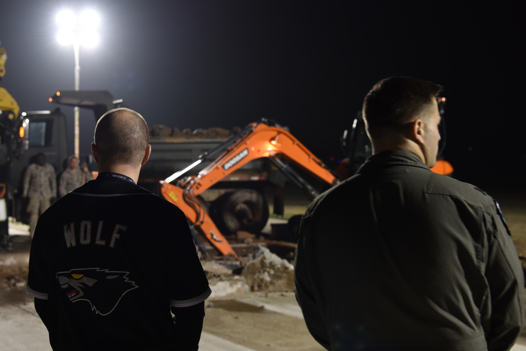 (Left) U.S. Air Force Col. John Bosone, 8th Fighter Wing commander, and Lt. Col. Oliver Lause, 35th Fighter Squadron commander, check the progress on rupture damage repairs at Kunsan Air Base, Republic of Korea, May 1, 2019. The 8th CES provided emergency repairs to the flight line to make it operational within 24 hours after it was closed unexpectedly due to a sinkhole. (U.S. Air Force photo by Staff Sgt. Joshua Edwards)