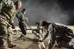 U.S. Air Force 8th Civil Engineer Squadron members smooth concrete on the flight line at Kunsan Air Base, Republic of Korea, May 2, 2019. The 8th CES applied rapid airfield damage repair methods to fix a rupture that caused damage to the flight line. (U.S. Air Force photo by Staff Sgt. Joshua Edwards)