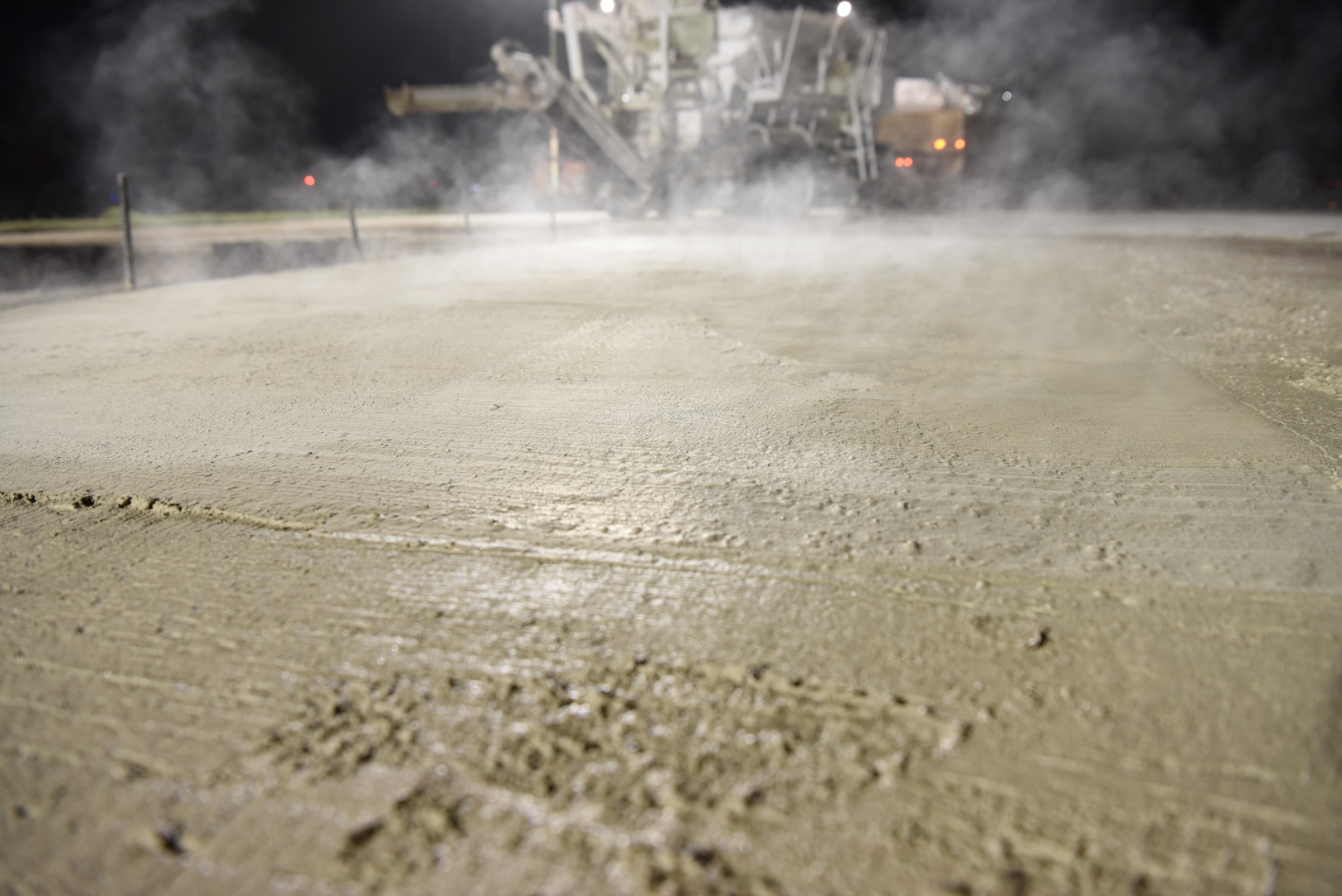 Concrete steams as it dries after runway repairs at Kunsan Air Base, Republic of Korea, May 2, 2019. The U.S. Air Force 8th Civil Engineer Squadron conducted a rapid response to a rupture that opened on the runway, and repaired the flight line within 24 hours. (U.S. Air Force photo by Staff Sgt. Joshua Edwards)