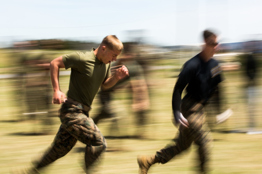 U.S. Marines with 3rd Battalion, 12th Marine Regiment, 3rd Marine Division, undergo an oleoresin capsicum spray course during the Artillery Relocation Training Program 19-1 at the Combined Arms Training Center, Camp Fuji, Japan, April 28, 2019. The course requires Marines to complete various physical tasks while under the effects of OC spray in order to prepare for potential real-life scenarios.