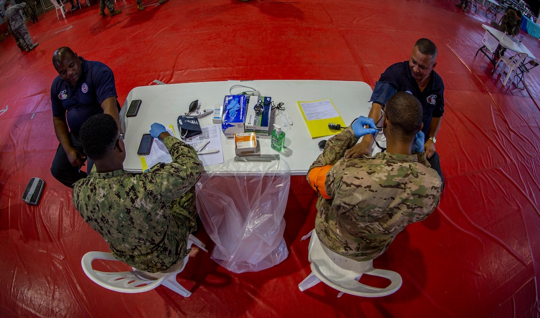 Service members provide medical care to patients at Ponce, Puerto Rico, April 27, 2019, during Innovative Readiness Training Puerto Rico. The purpose of the Innovative Readiness Training Puerto Rico is to provide dental, optometry and medical care to the community while performing joint military humanitarian operations. Marine Forces Reserve is participating in IRT Puerto Rico 2019 in order to maintain military readiness while strengthening alliances with partners. (U.S. Marine Corps photo by Sgt. Andy O. Martinez)