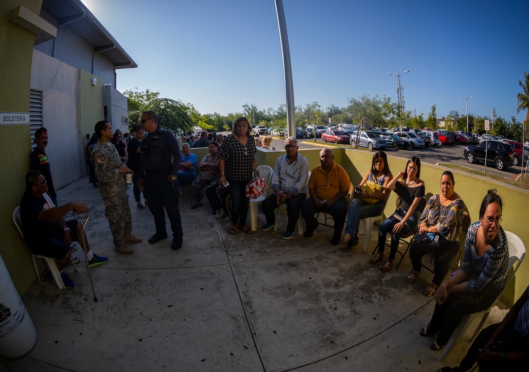 People from the local community wait for medical services at Ponce, Puerto Rico, April 27, 2019, during Innovative Readiness Training Puerto Rico. The purpose of the Innovative Readiness Training Puerto Rico is to provide dental, optometry and medical care to the community while performing joint military humanitarian operations. Marine Forces Reserve is participating in IRT Puerto Rico 2019 in order to maintain military readiness while strengthening alliances with partners. (U.S. Marine Corps photo by Sgt. Andy O. Martinez)