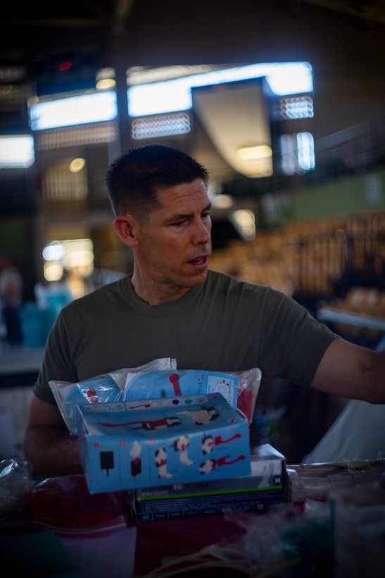 Navy Lt. Cmdr. Jason Morris, an orthodontist with 4th Dental Battalion, 4th Marine Logistics Group, Marine Forces Reserve, participates in Innovative Readiness Training Puerto Rico at Yauco, Puerto Rico, April 27, 2019. The purpose of the Innovative Readiness Training Puerto Rico is to provide dental, optometry and medical care to the community while performing joint military humanitarian operations. Marine Forces Reserve is participating in IRT Puerto Rico 2019 in order to maintain military readiness while strengthening alliances with partners. (U.S. Marine Corps photo by Sgt. Andy O. Martinez)