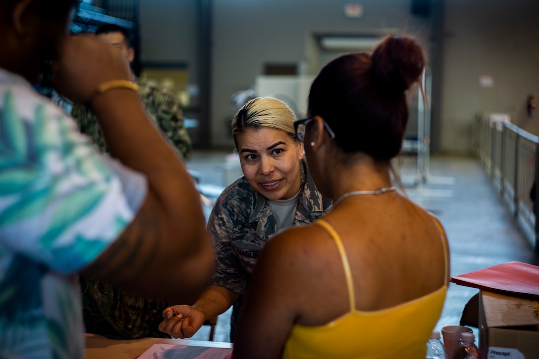 Air Force Tech. Sgt. Jessica Martinez, a dental technician with 185th Medical Group, 185th Air Refueling Wing, works with a patient at Ponce, Puerto Rico, April 27, 2019, during Innovative Readiness Training Puerto Rico. The purpose of the Innovative Readiness Training Puerto Rico is to provide dental, optometry and medical care to the community while performing joint military humanitarian operations. Marine Forces Reserve is participating in IRT Puerto Rico 2019 in order to maintain military readiness while strengthening alliances with partners. (U.S. Marine Corps photo by Sgt. Andy O. Martinez)