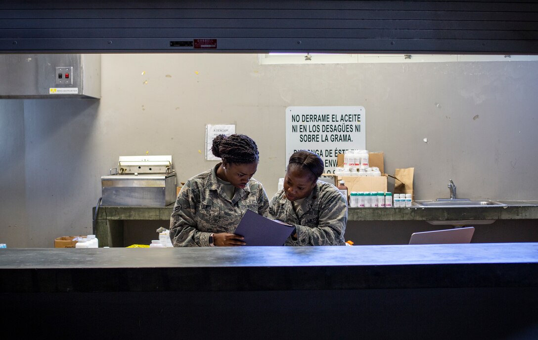 U.S. Air Force Airman 1st Class Breaunna N. Lewis, a medical technician with 187th Medical Group, (left), and U.S. Air Force Maj. Rashida A. Fambro, a pharmacist with 187th Medical Detachment 1 Chemical, Biological, Radiological, Nuclear and high-yield Explosive Enhanced Response Force Package, run the pharmacy station at Ponce, Puerto Rico, April 28, 2019, during Innovative Readiness Training Puerto Rico. IRT Puerto Rico is also called Ola de Esperanza Sanadora, which translates to Healing Wave of Hope. This IRT is part of a civil and joint military program to improve military readiness while simultaneously providing quality services to underserved communities throughout the United States. (U.S. Marine Corps photo by Sgt. Andy O. Martinez)