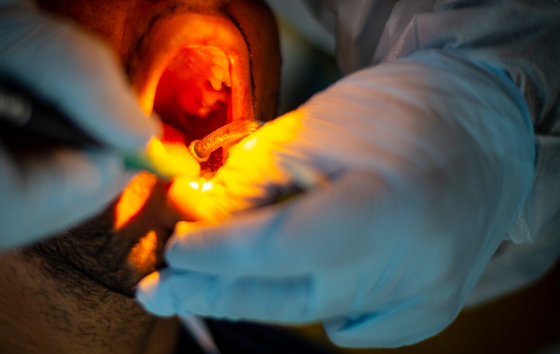 A U.S. Army Solider provides dental care to a patient at Yauco, Puerto Rico, April 28, 2019, during Innovative Readiness Training Puerto Rico. IRT Puerto Rico is also called Ola de Esperanza Sanadora, which translates to Healing Wave of Hope. This IRT is part of a civil and joint military program to improve military readiness while simultaneously providing quality services to underserved communities throughout the United States. (U.S. Marine Corps photo by Sgt. Andy O. Martinez)