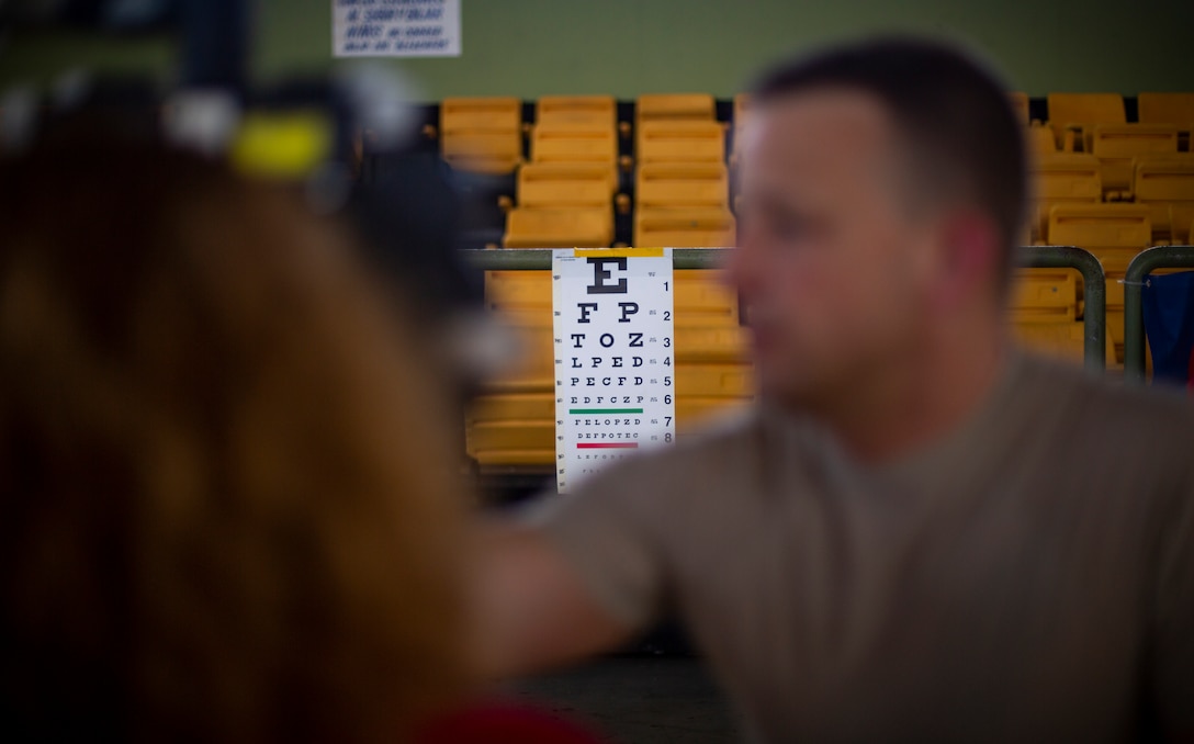 U.S. service members provide optometry care to patients at Yauco, Puerto Rico, April 28, 2019, during Innovative Readiness Training Puerto Rico. IRT Puerto Rico is also called Ola de Esperanza Sanadora, which translates to Healing Wave of Hope. This IRT is part of a civil and joint military program to improve military readiness while simultaneously providing quality services to underserved communities throughout the United States. (U.S. Marine Corps photo by Sgt. Andy O. Martinez)
