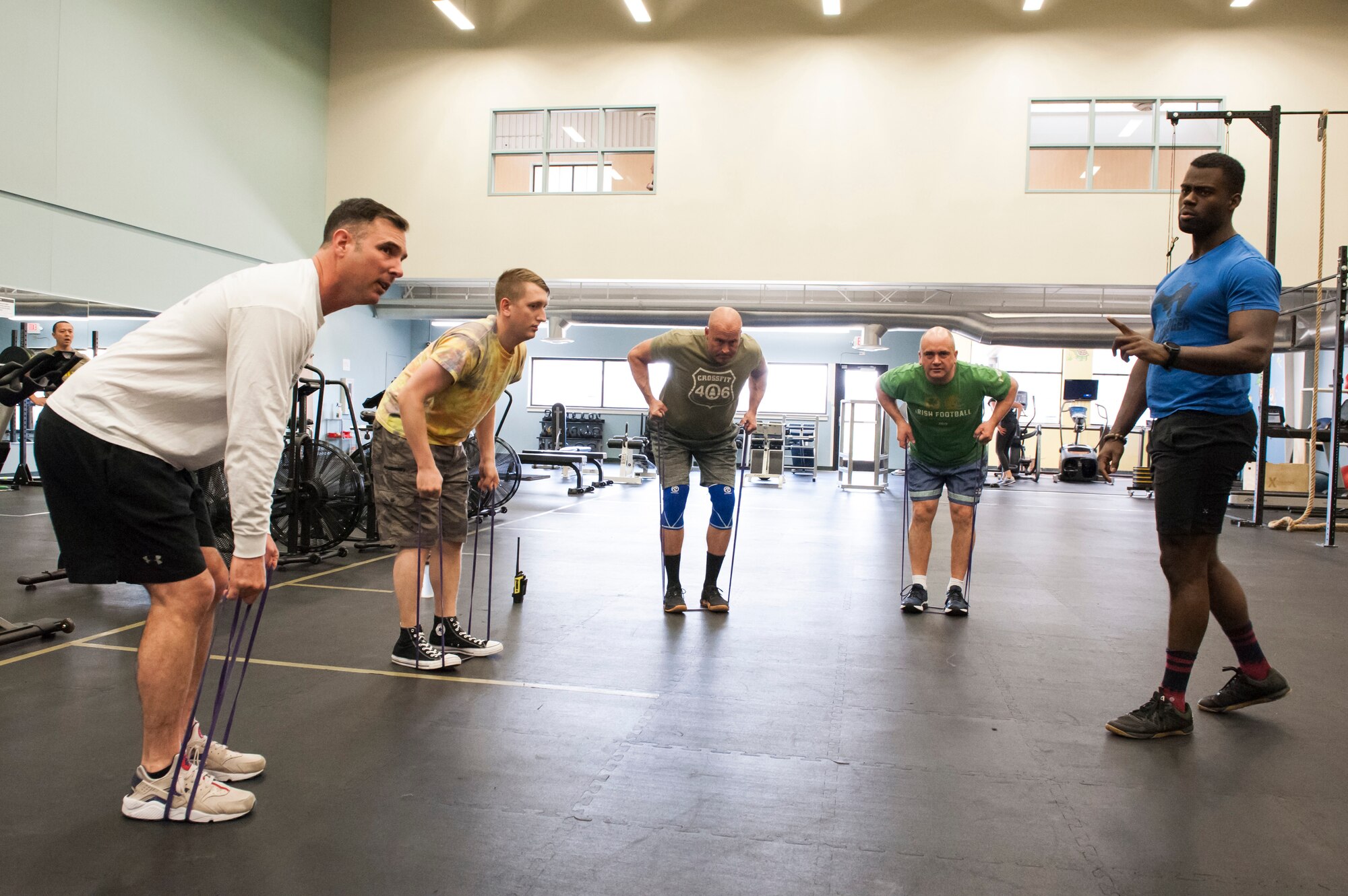 TJ Dunhart, 341st Force Support Squadron Fitness Center director instructs a “Wing One” fitness class in pre-workout stretches April 29, 2019, at Malmstrom Air Force Base, Mont.