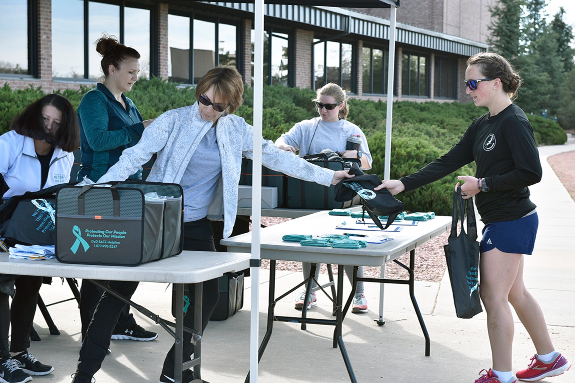 21st Space Wing Sexual Assault Prevention and Response team run a Walk-a-Lap event in support of sexual assault awareness and prevention month