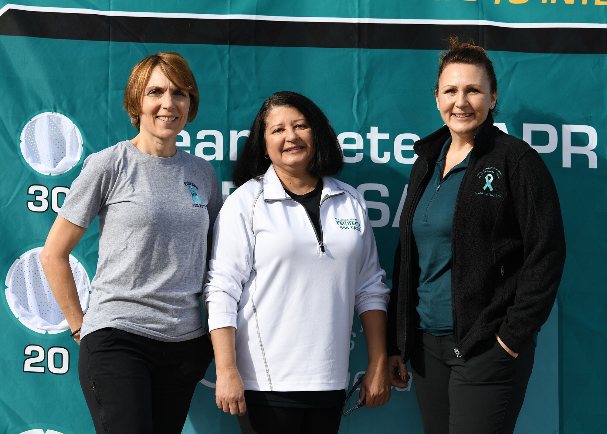 Sherri Giulio (left), Maria Spencer (center) and Lorinda Pirrie (right), members of the 21st Space Wing Sexual Assault Prevention and Response team