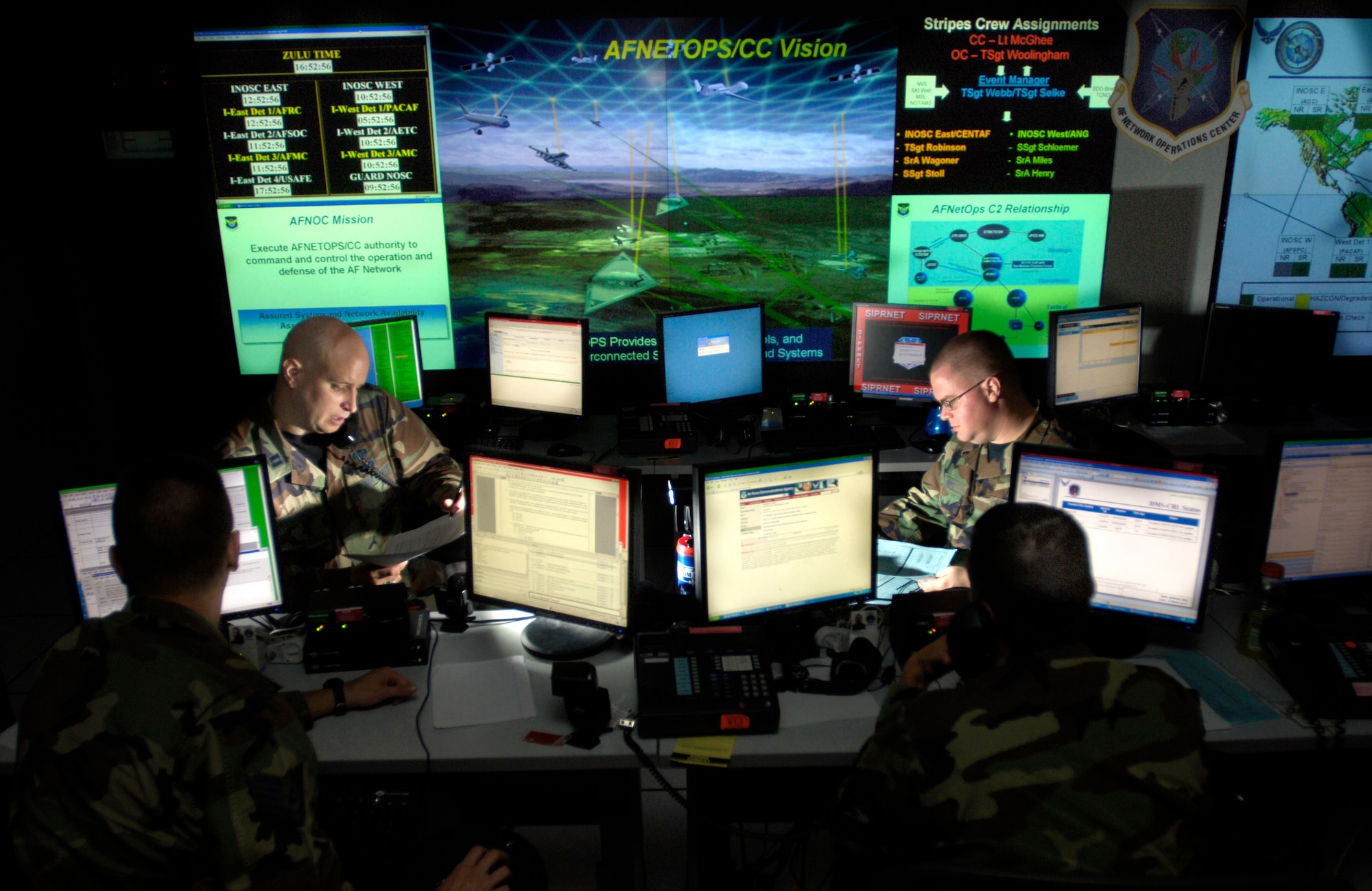 Capt. Jason Simmons and Staff Sgt. Clinton Tips update anti-virus software for Air Force units to assist in the prevention of cyberspace hackers July 12, 2007 at Barksdale Air Force Base, La. The Air Force is setting up the Air Force Cyberspace Command soon and these Airmen will be the operators on the ground floor. (U.S. Air Force photo/Tech. Sgt. Cecilio Ricardo)