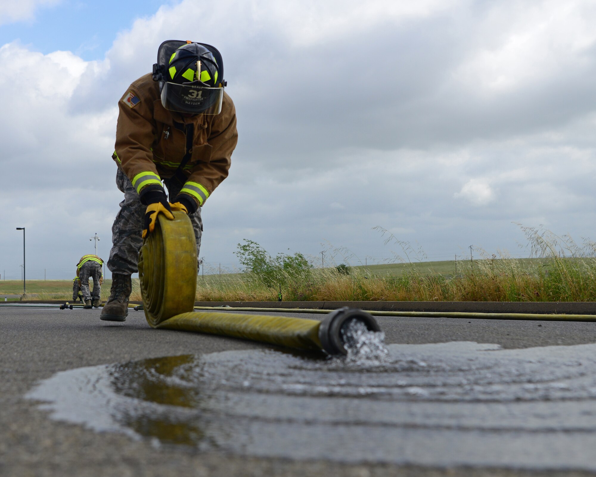 9th CES fire fighters test, certify fire hoses