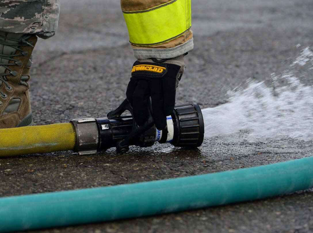 9th CES fire fighters test, certify fire hoses