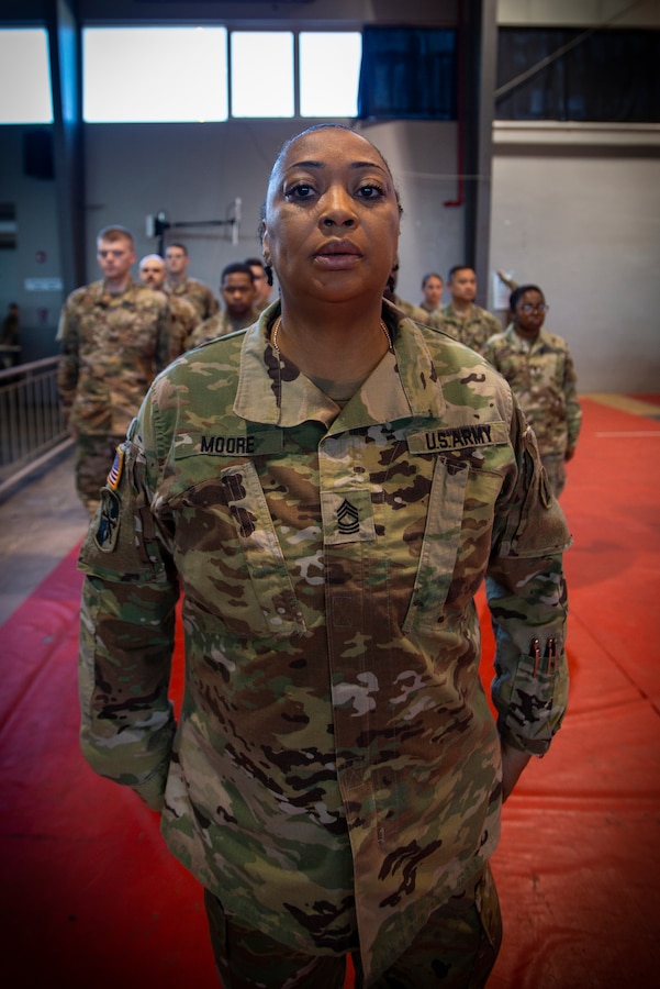 U.S. Army Master Sgt. Jacqueline Moore stands in formation in preparation for a promotion at Ponce, Puerto Rico, April 30, 2019, during Innovative Readiness Training Puerto Rico. IRT Puerto Rico is also called Ola de Esperanza Sanadora, which translates to Healing Wave of Hope. This IRT is part of a civil and joint military program to improve military readiness while simultaneously providing quality services to underserved communities throughout the United States. (U.S. Marine Corps photo by Sgt. Andy O. Martinez)