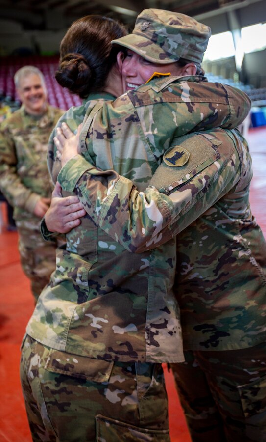 U.S. Army Maj. Melissa M. Pietras, the medical officer in charge of Innovative Readiness Training Puerto Rico (right), hugs U.S. Army Maj. Alexandra Dillon, an Army Nurse Corps officer with Delaware National Guard, at Ponce, Puerto Rico, April 30, 2019. IRT Puerto Rico is also called Ola de Esperanza Sanadora, which translates to Healing Wave of Hope. This IRT is part of a civil and joint military program to improve military readiness while simultaneously providing quality services to underserved communities throughout the United States. (U.S. Marine Corps photo by Sgt. Andy O. Martinez)