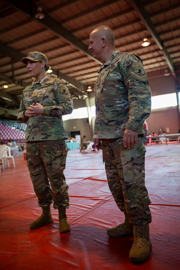 U.S. Army Brig. Gen. Michael R. Berry, the adjutant general of Delaware National Guard (right), and U.S. Army Maj. Melissa M. Pietras, the medical officer in charge for the Innovative Readiness Training Puerto Rico (left), speak to service members during a promotion ceremony at Ponce, Puerto Rico, April 30, 2019. IRT Puerto Rico is also called Ola de Esperanza Sanadora, which translates to Healing Wave of Hope. This IRT is part of a civil and joint military program to improve military readiness while simultaneously providing quality services to underserved communities throughout the United States. (U.S. Marine Corps photo by Sgt. Andy O. Martinez)