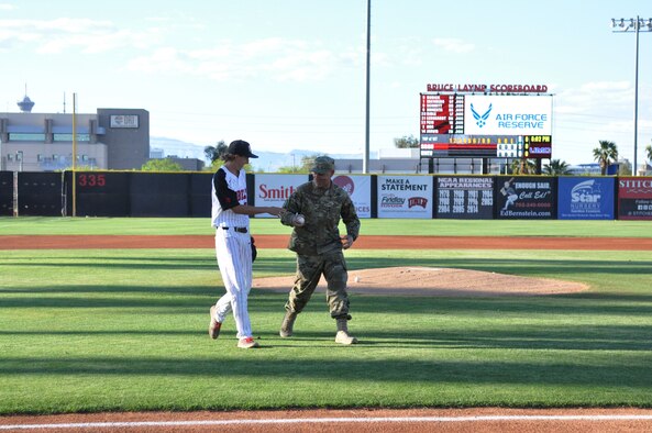 Master Sgt. Dustin Watson, a dedicated crew chief in the 926th Aircraft Maintenance Squadron, threw out the first pitch at a UNLV Rebels baseball game April 26 against San Diego State at Earl E. Wilson Stadium. Watson was named Crew Chief of the Year for the Air Force Reserve Command earlier this month. (U.S. Air Force photo by Maj. Candice Allen)