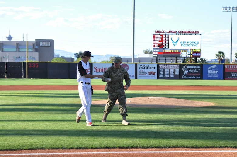 Master Sgt. Dustin Watson, a dedicated crew chief in the 926th Aircraft Maintenance Squadron, threw out the first pitch at a UNLV Rebels baseball game April 26 against San Diego State at Earl E. Wilson Stadium. Watson was named Crew Chief of the Year for the Air Force Reserve Command earlier this month. (U.S. Air Force photo by Maj. Candice Allen)