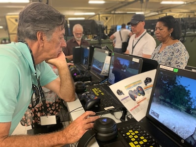 Mr. Bob Tyra, a contract consultant for the Los Angeles County Office of Education checks out the new simulation systems during the Army Educator Tour.