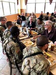 Attendees of the Army Educator Tour had lunch with Soldiers at a dining facility.