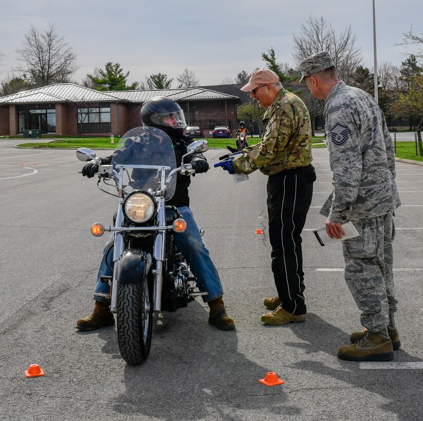 Senior Master Sgt. Vince Bartlomain, a standards and evaluation flight engineer assigned to the 910th Operations Group, and Master Sgt. Phil Walsh, aircrew flight supervisor assigned to the 910th Operations Support Squadron, discuss safety maneuverability and stops skills with Senior Airman James Henthorne, an avionics specialist assigned to the 910th Aircraft Maintenance Squadron, on April 12, 2019, at a parking lot in YARS.